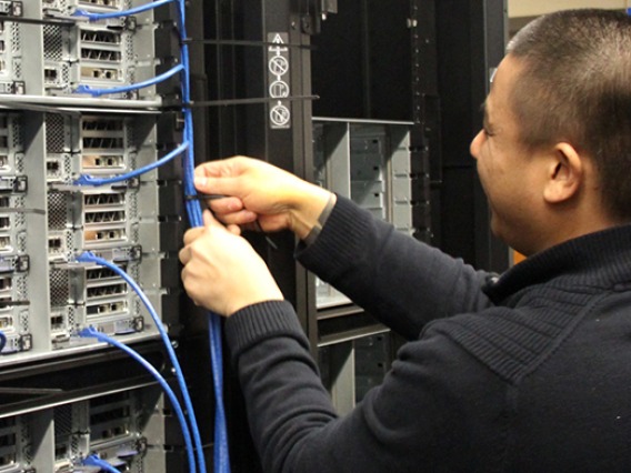 A tech from PCPC Direct installs new nodes in the Research Data Center