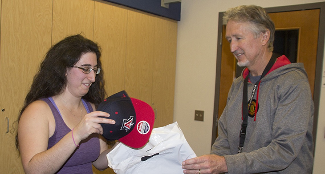 Ariella Gladstein accepts prize package from Research Data Center's Chris Reidy